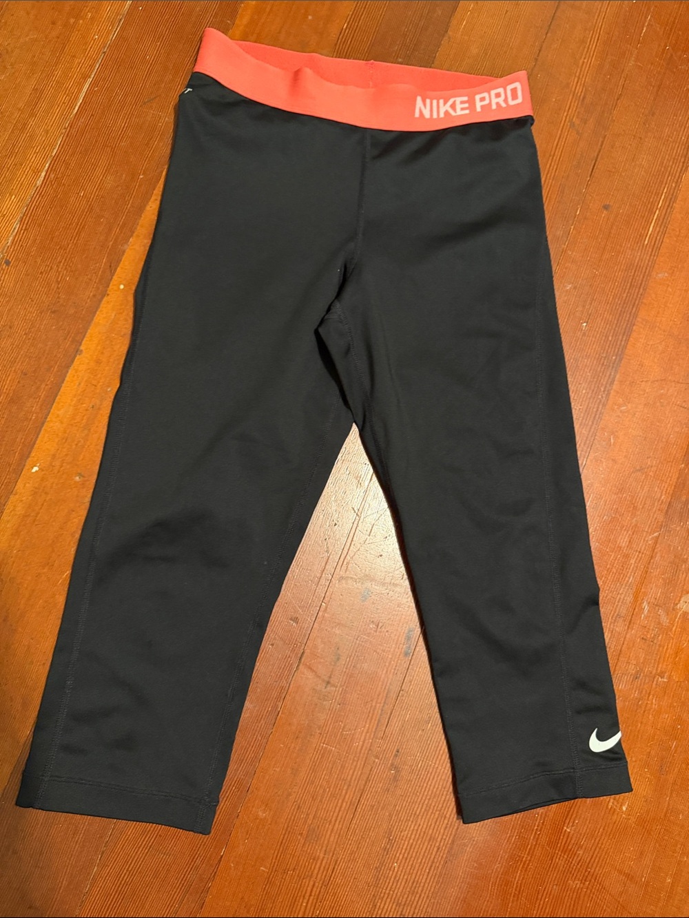 Women’s Nike Black Cropped Leggings with Coral Waistband
